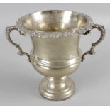 An Edwardian silver small wine cooler with two floral decorated handles,