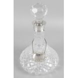 A silver mounted glass decanter,