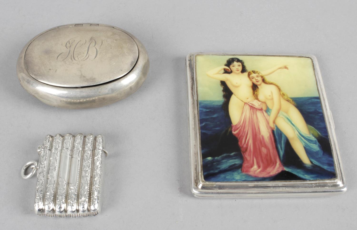 A small collection of five novelty items to include a ribbed vesta case - Birmingham 1900 - an oval