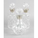 A pair of cut glass decanters and stoppers,