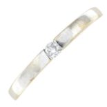 A diamond single-stone band ring.