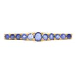 A mid 20th century gold sapphire bar brooch.