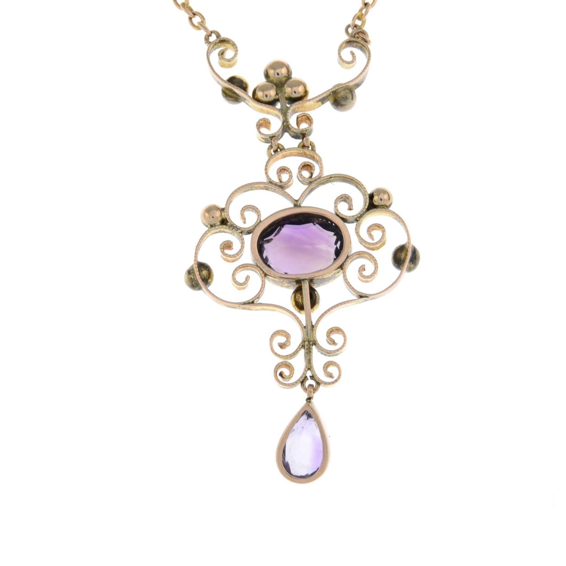 An early 20th century gold amethyst pendant, on an integral chain.Length of pendant drop 4.5cms. - Image 2 of 2