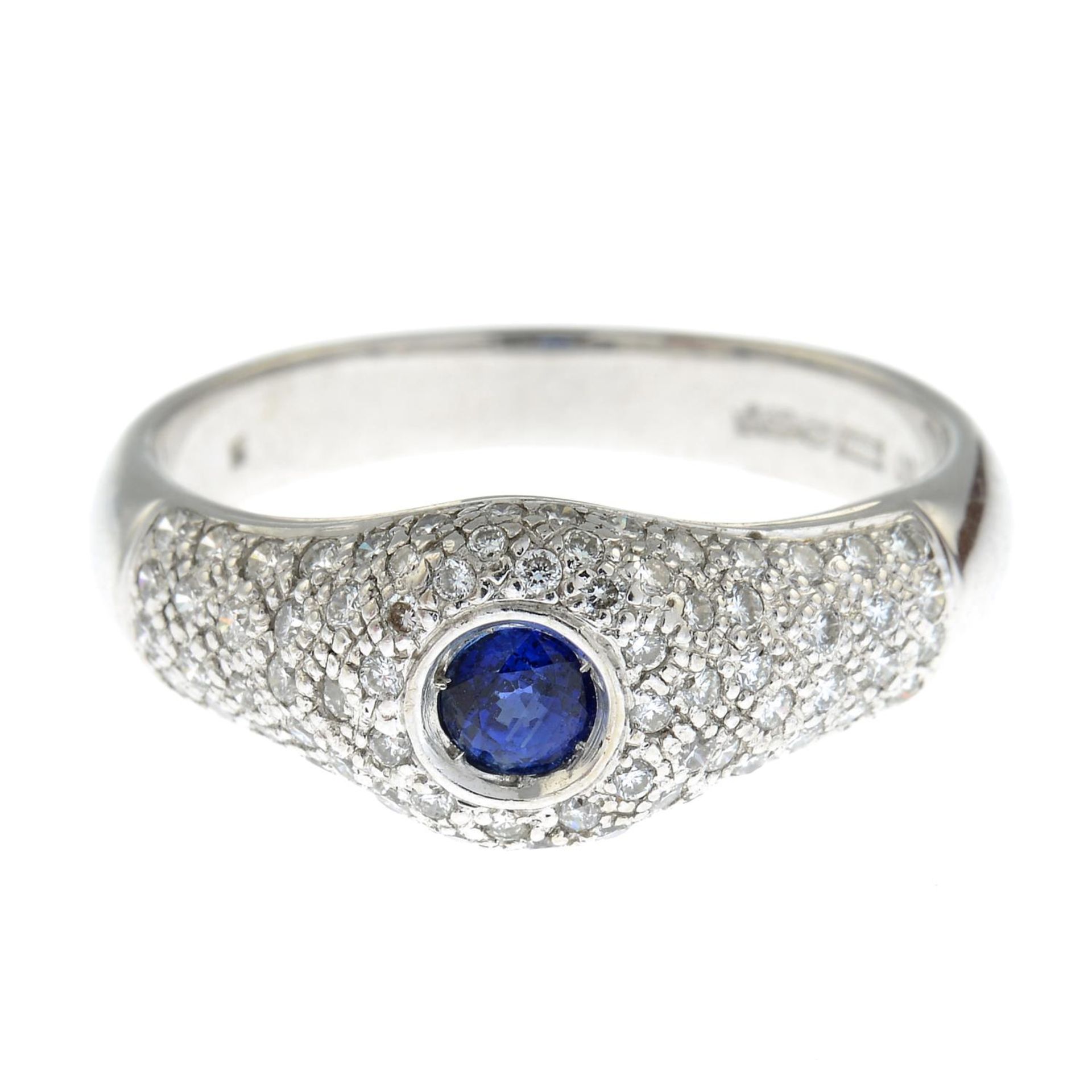 An 18ct gold sapphire and pave-set diamond ring.Estimated total diamond weight 0.50ct.Hallmarks for