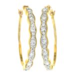 A pair of 9ct gold diamond hoop earrings.Estimated total diamond weight 0.30ct.
