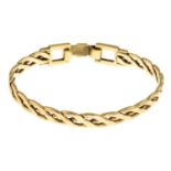 A 9ct gold openwork bangle.Hallmarks for 9ct gold.