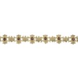 A 9ct gold garnet bracelet.Hallmarks for 9ct gold.