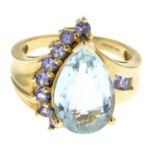 A 9ct gold aquamarine and gem-set dress ring.Hallmarks for 9ct gold.