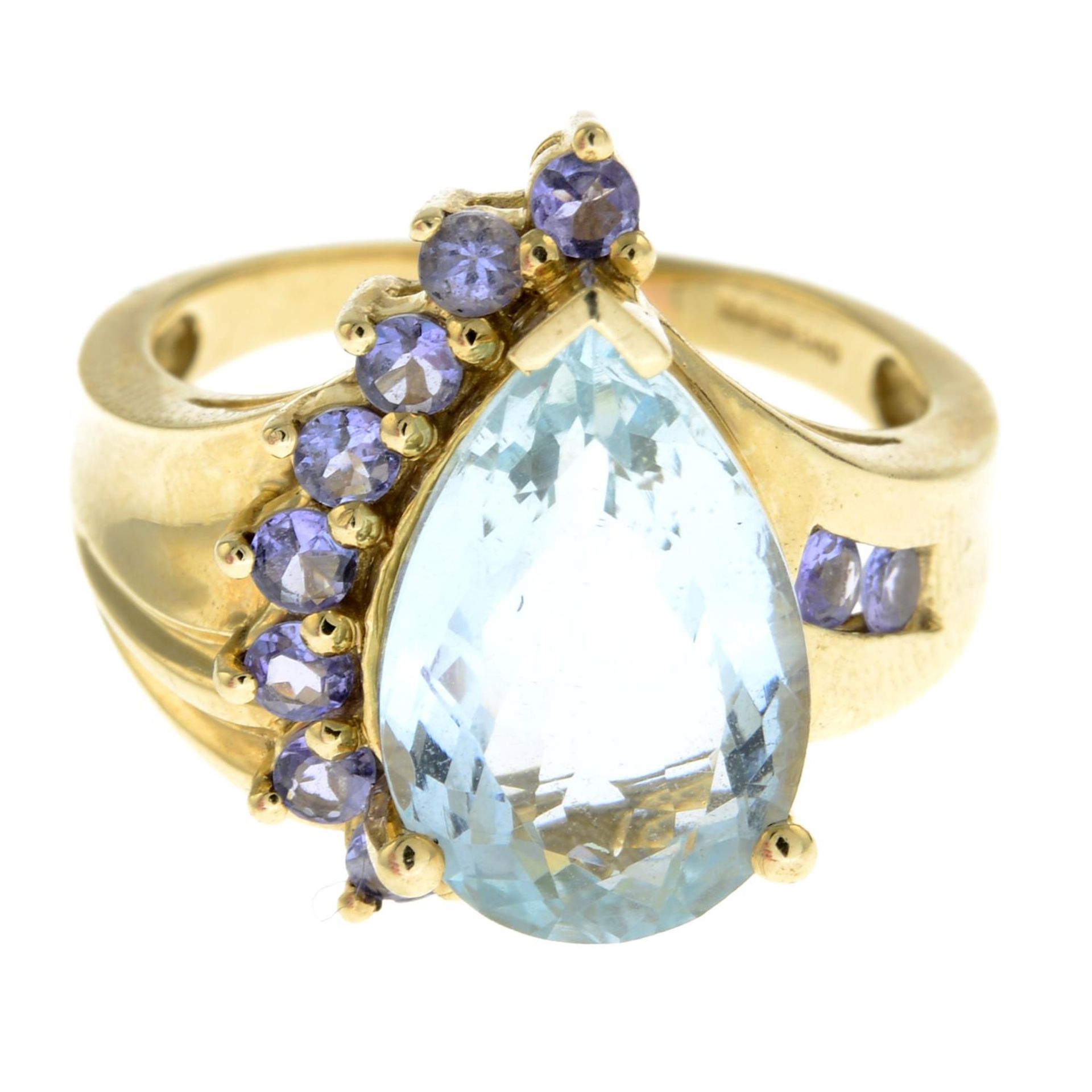 A 9ct gold aquamarine and gem-set dress ring.Hallmarks for 9ct gold.