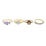 Four 9ct gold diamond and gem-set dress rings, to include a diamond floral cluster ring.