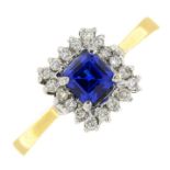 A synthetic sapphire and diamond cluster ring.Estimated total diamond weight 0.10ct.Stamped 750.