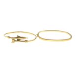 Two 9ct gold bangles, one with dolphin motif.Import marks for Birmingham, 1989 and Sheffield.