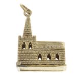 A charm, designed to depict a church, open to reveal a wedding couple.Length 2.7cms.