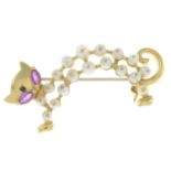 A cultured pearl and pink sapphire openwork cat brooch.Stamped 18K.