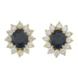 A pair of sapphire and colourless gem cluster earrings.Butterfly backers stamped 585.Length 1cm.