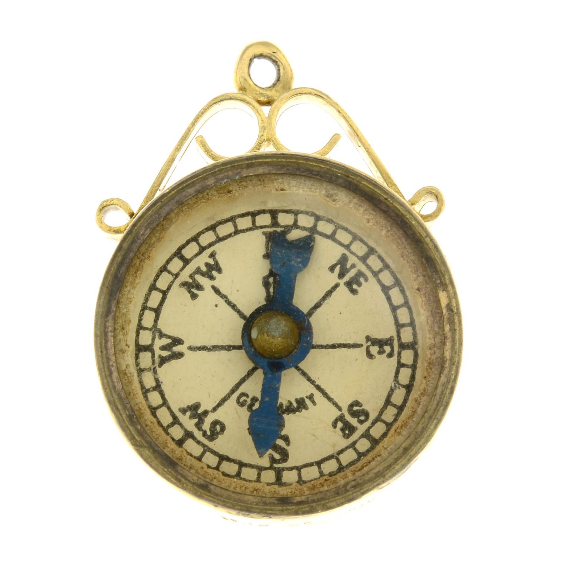 A 9ct gold compass pendant, with St.