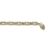 A 9ct gold fancy-link bracelet, gathered at a 9ct gold heart padlock clasp.Hallmarks for 9ct gold.