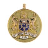 A mid 20th century 9ct gold enamel medallion pendant.