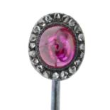 A late 19th century diamond and ruby cluster stickpin.Length of stickpin head 0.9cm.