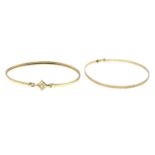 Four bangles.One with hallmarks for 9ct gold, inner diameter 5.5cms, 1.7gms.