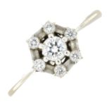 An 18ct gold brilliant and baguette-cut diamond cluster ring.Estimated total diamond weight 0.50ct,