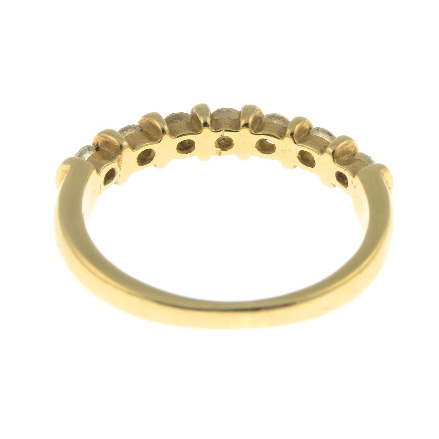 An 18ct gold diamond seven-stone ring.Total diamond weight 0.40ct, stamped to band. - Image 2 of 3