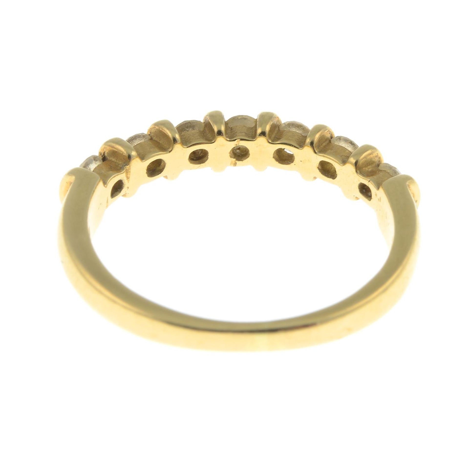 An 18ct gold diamond seven-stone ring.Total diamond weight 0.40ct, stamped to band. - Bild 2 aus 3