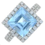 A blue topaz and diamond ring.Estimated total diamond weight 0.45ct.