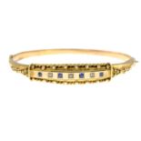 A late Victorian 9ct gold blue gem and diamond point hinged bangle.Hallmarks for Chester, 18958.