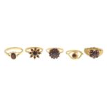 Five 9ct gold garnet rings.One AF.Hallmarks for 9ct gold.Ring sizes H to O.