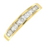 An 18ct gold brilliant and baguette-cut diamond half eternity ring.Estimated total diamond weight