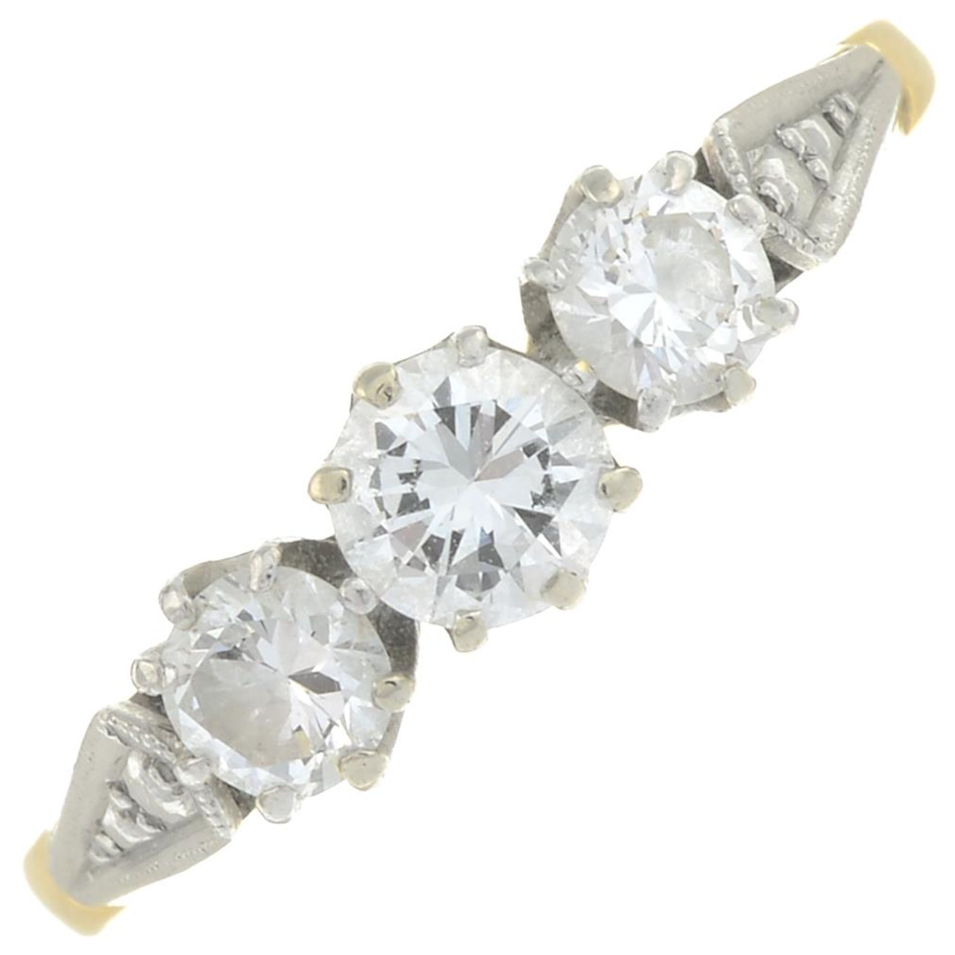 A mid 20th century 18ct gold and platinum brilliant-cut diamond three-stone ring.Estimated total