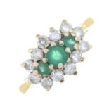 An 18ct gold emerald and brilliant-cut diamond dress ring.Estimated total diamond weight 0.60ct,