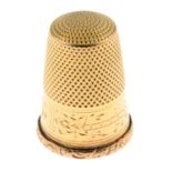 An early 20th century gold thimble.Length 2.3cms.