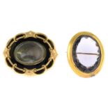 A late Victorian enamel mourning brooch and an amethyst brooch.