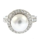 A platinum cultured pearl and pave-set diamond cocktail ring.Estimated total diamond weight
