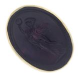 A purple paste signet ring, carved to depict a Greek goddess.Stamped 9CT.