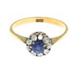 A sapphire and diamond cluster ring.Estimated total diamond weight 0.20ct.