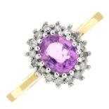 An 18ct gold pink sapphire and diamond cluster ring.Estimated total diamond weight 0.15ct.