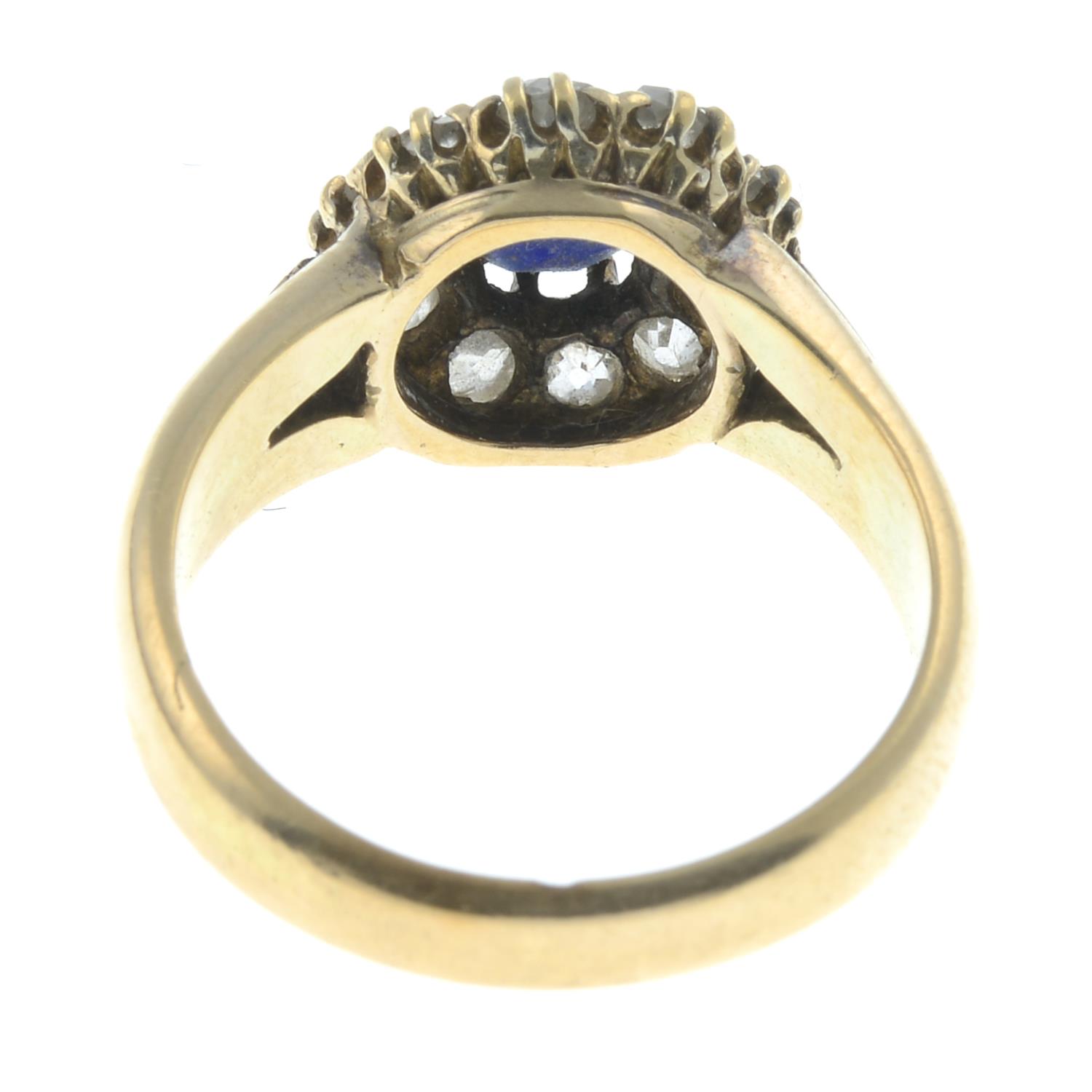 A sapphire and diamond cluster ring.Estimated total diamond weight 0.70ct. - Image 2 of 2