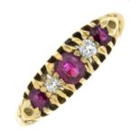 An 18ct gold ruby and diamond five-stone ring.Estimated total diamond weight 0.10ct.