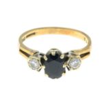 A 9ct gold sapphire and diamond three-stone ring.Estimated total diamond weight 0.15ct.