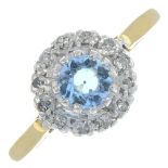 An 18ct gold aquamarine and diamond cluster ring.Estimated total diamond weight 0.10ct.