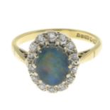 An 18ct gold opal triplet and diamond cluster ring.Estimated total diamond weight 0.15ct.