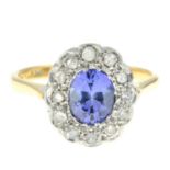 A synthetic sapphire and vari-cut diamond cluster ring.Stamped 18CT PLAT.