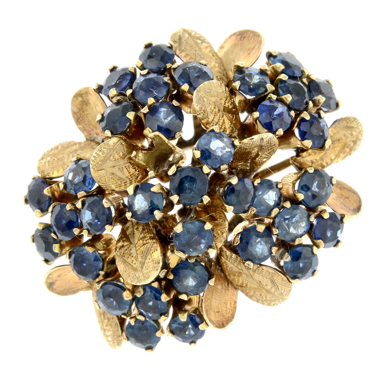 A sapphire floral dress ring.