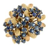 A sapphire floral dress ring.