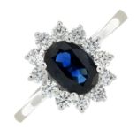 An 18ct gold sapphire and diamond cluster ring.Estimated total diamond weight 0.35ct.