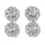A pair of 18ct gold diamond cluster drop earrings.Total diamond weight 1ct, stamped to mount.
