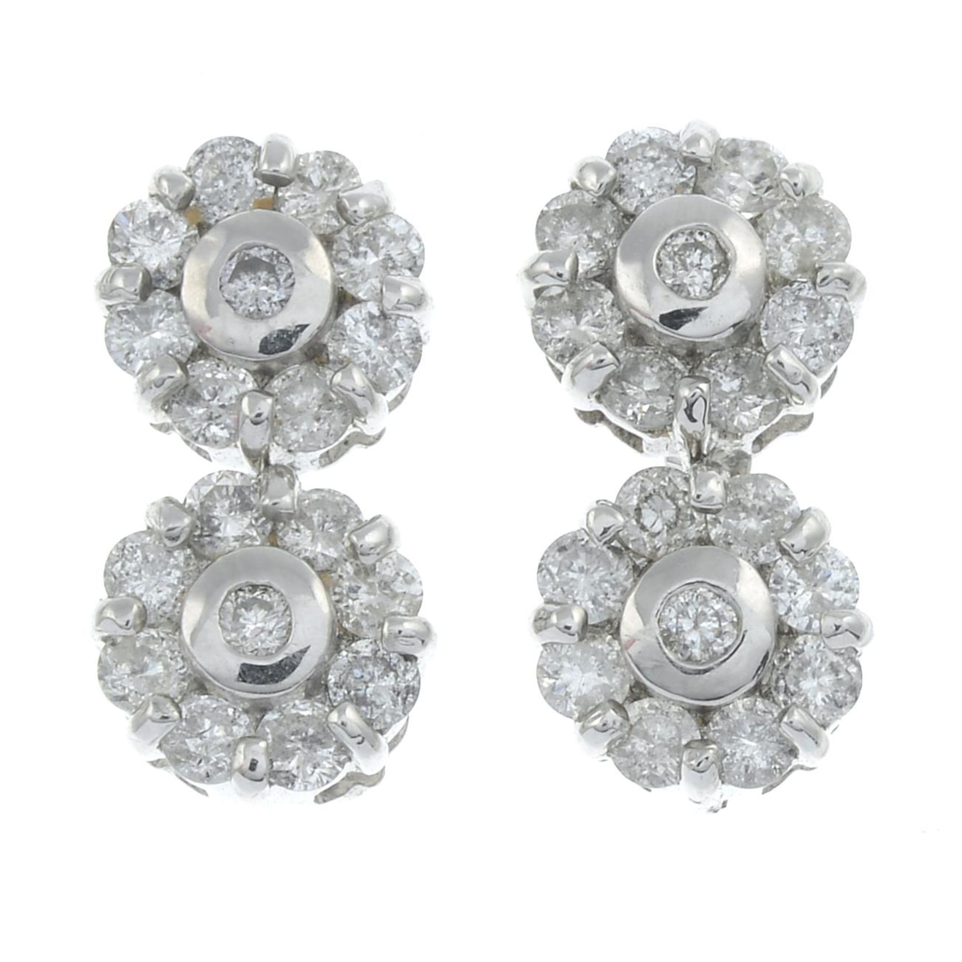 A pair of 18ct gold diamond cluster drop earrings.Total diamond weight 1ct, stamped to mount.